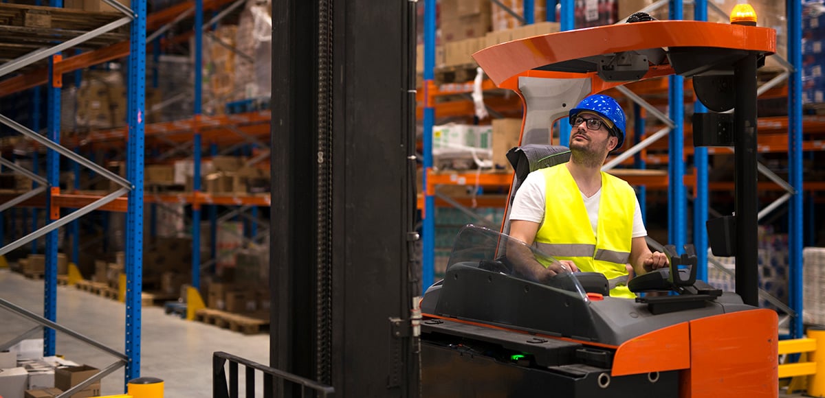 Person looking up inspecting forklift