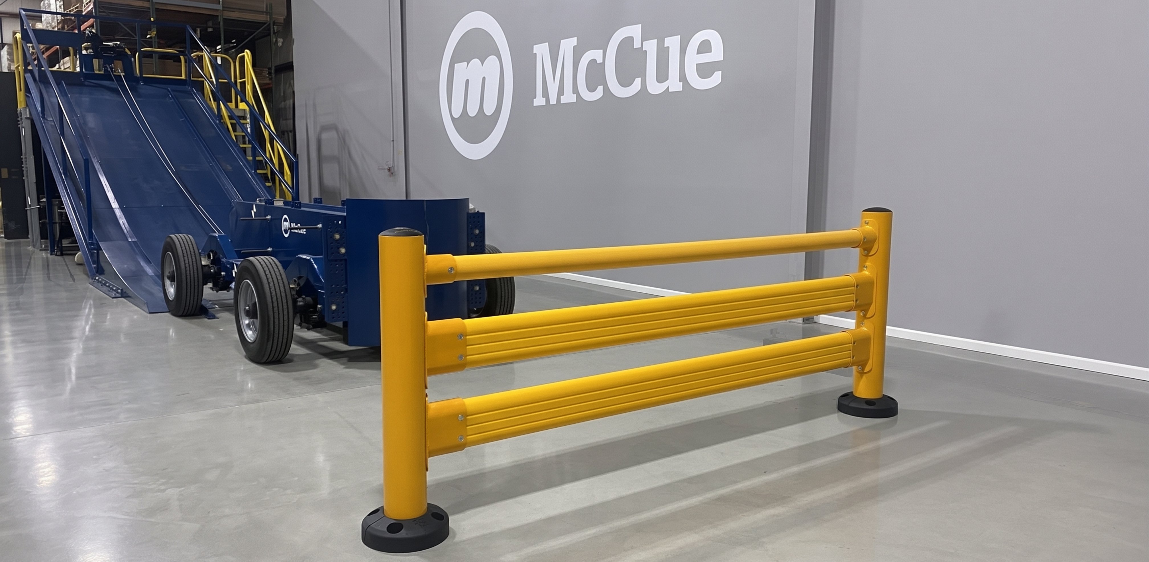 Bogie testing apparatus and SafeStop guardrail staged in McCue's industrial safety barrier testing center — internal dynamic impact testing facility