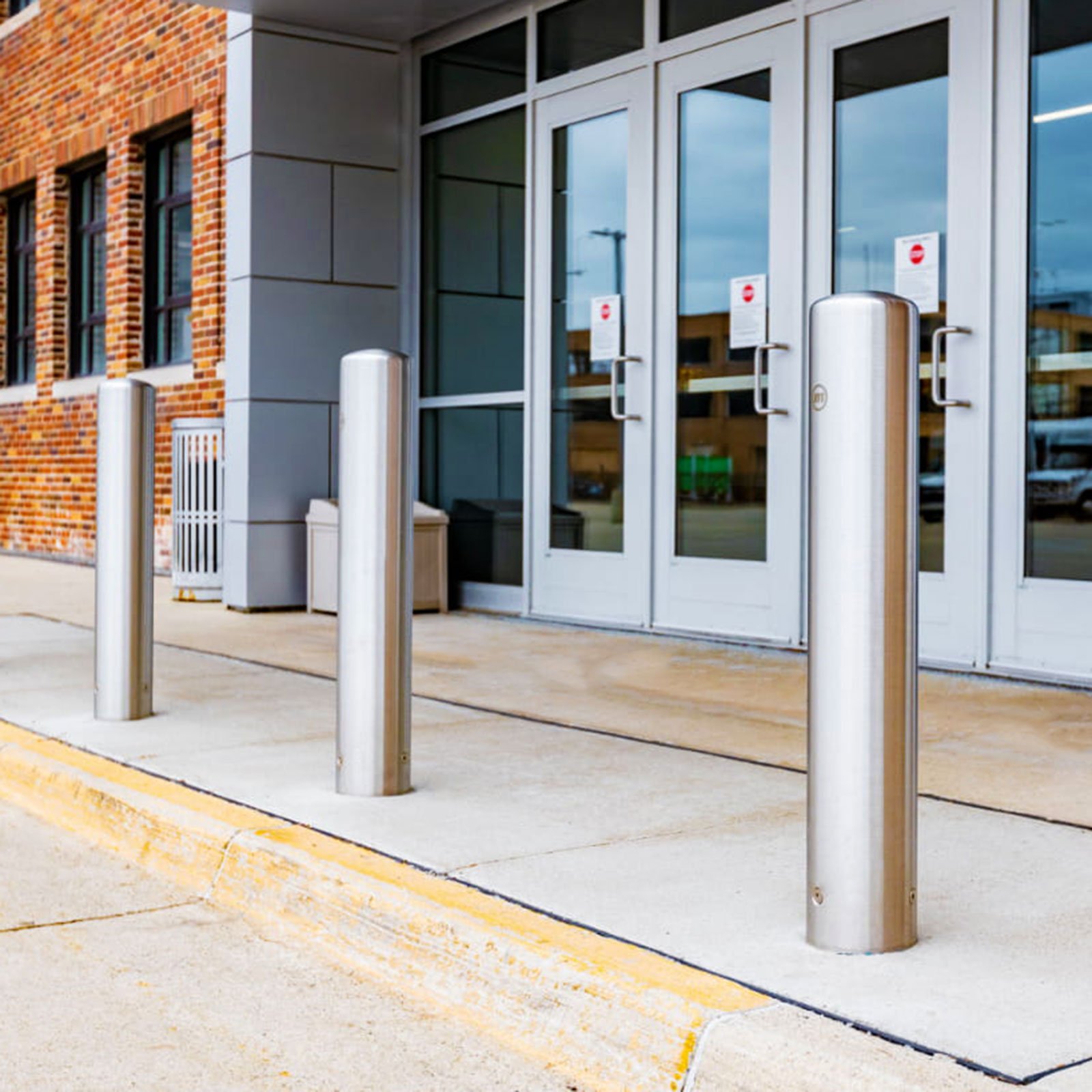 McCue Crash Tested ASTM F3016 CrashCore Bollard Protecting Store