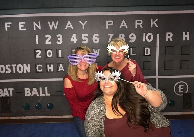 group photo of people wearing silly sunglasses