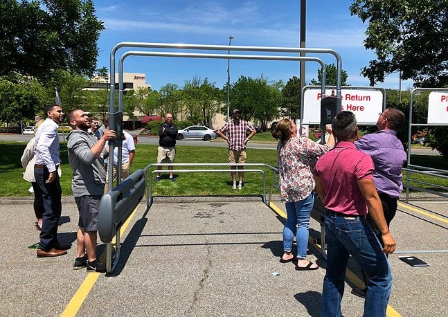 photo of people installing cart corral