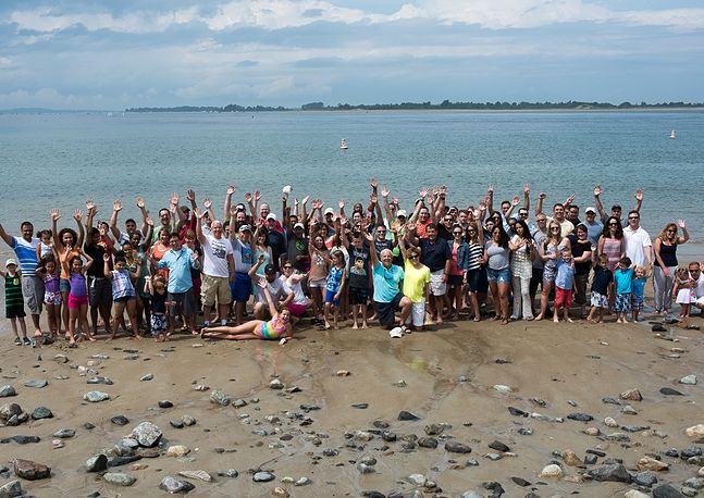 group photo of people at the beach