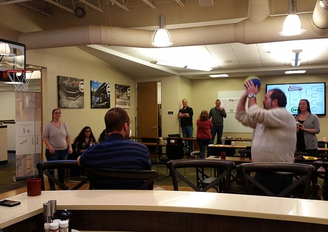 photo of someone shooting a basketball in a meeting space