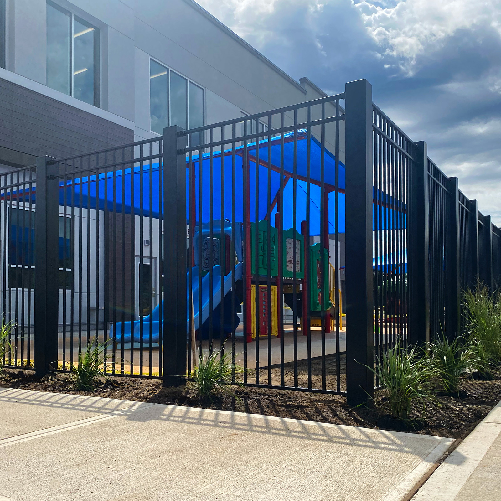 McCue Crash Tested ASTM F3016 CrashCore Bollard Protecting Store