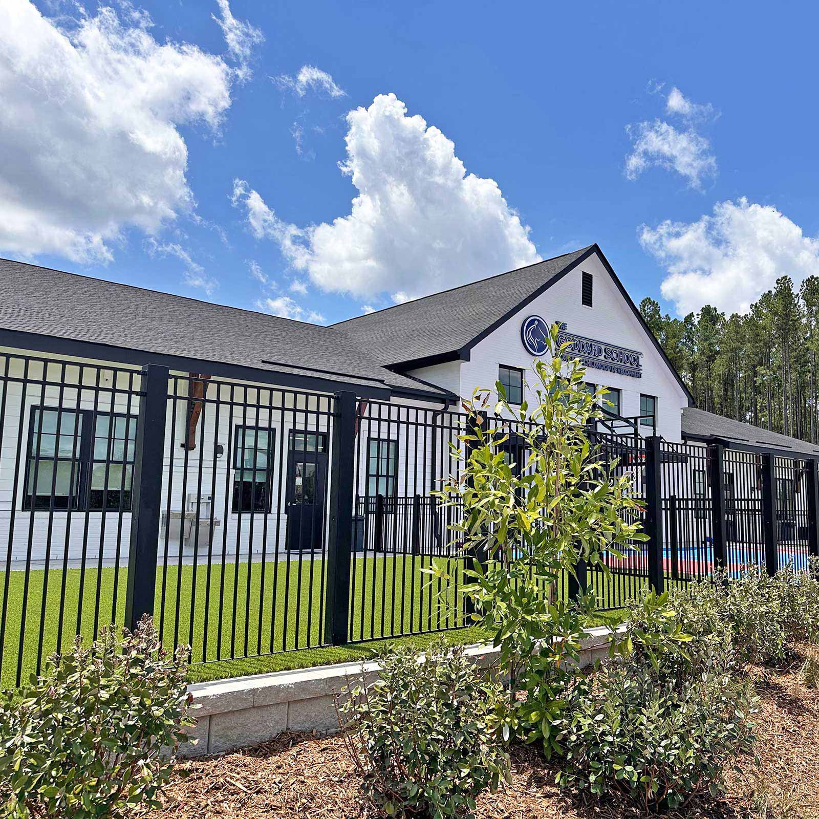 CrashCore Ornamental Fence S10 enclosing the outdoor play area at a Goddard School early education center