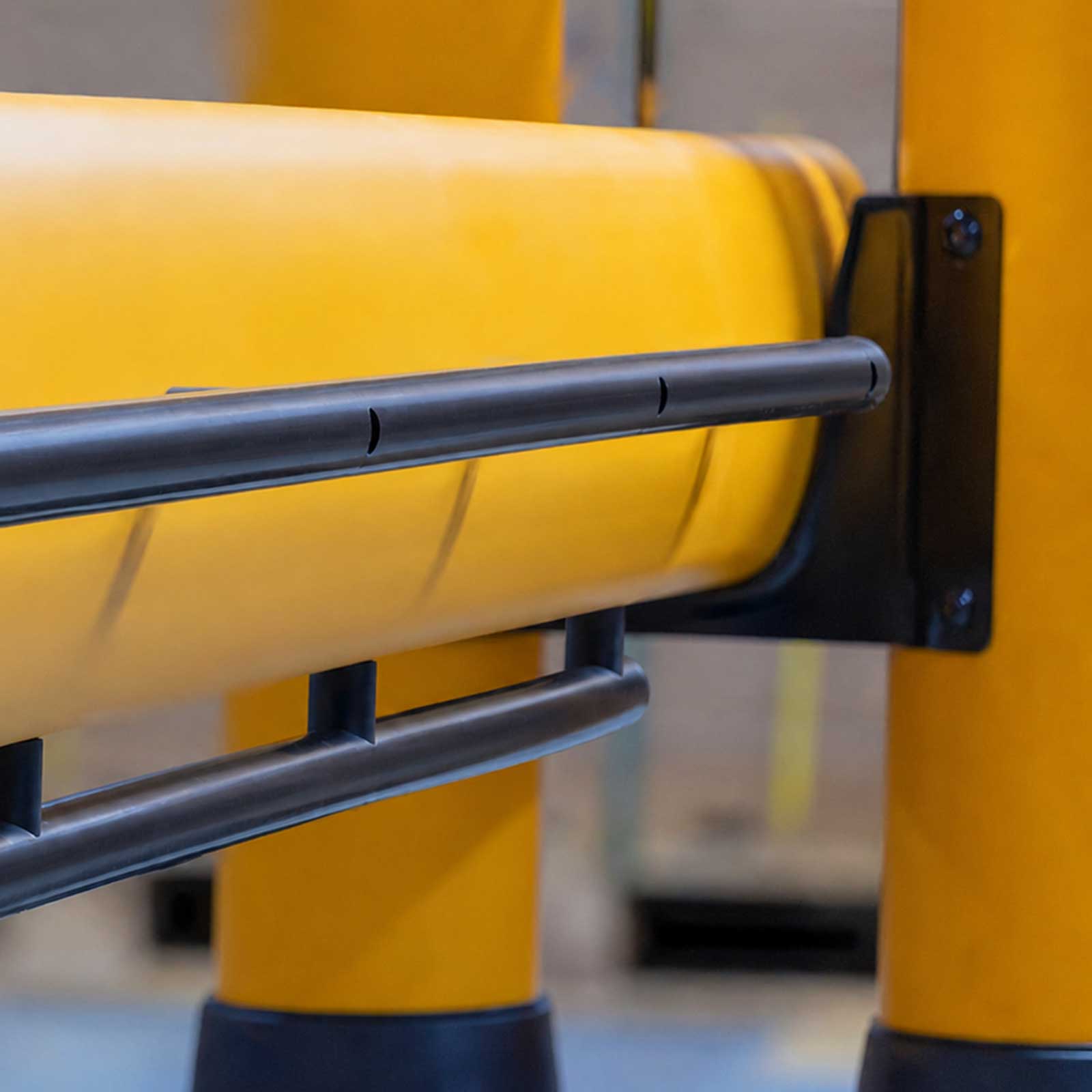 Close-up of the handle on a FLEX+ Safety Gate where the rail meets the gate's posts