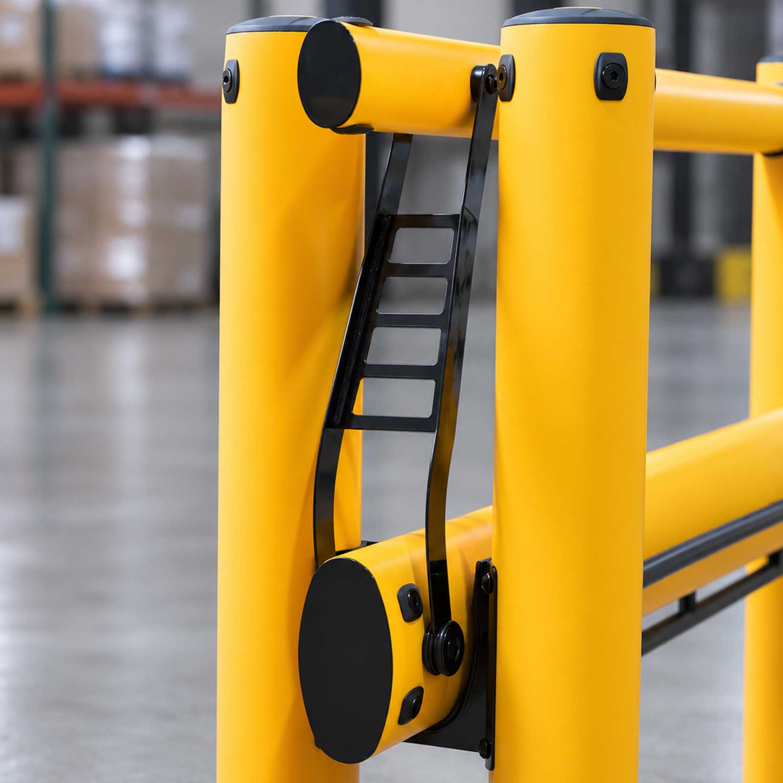 Close-up of the connector, rail stop pin, and catch on a FLEX+ Safety Gate that keep the rail from lifting on impact