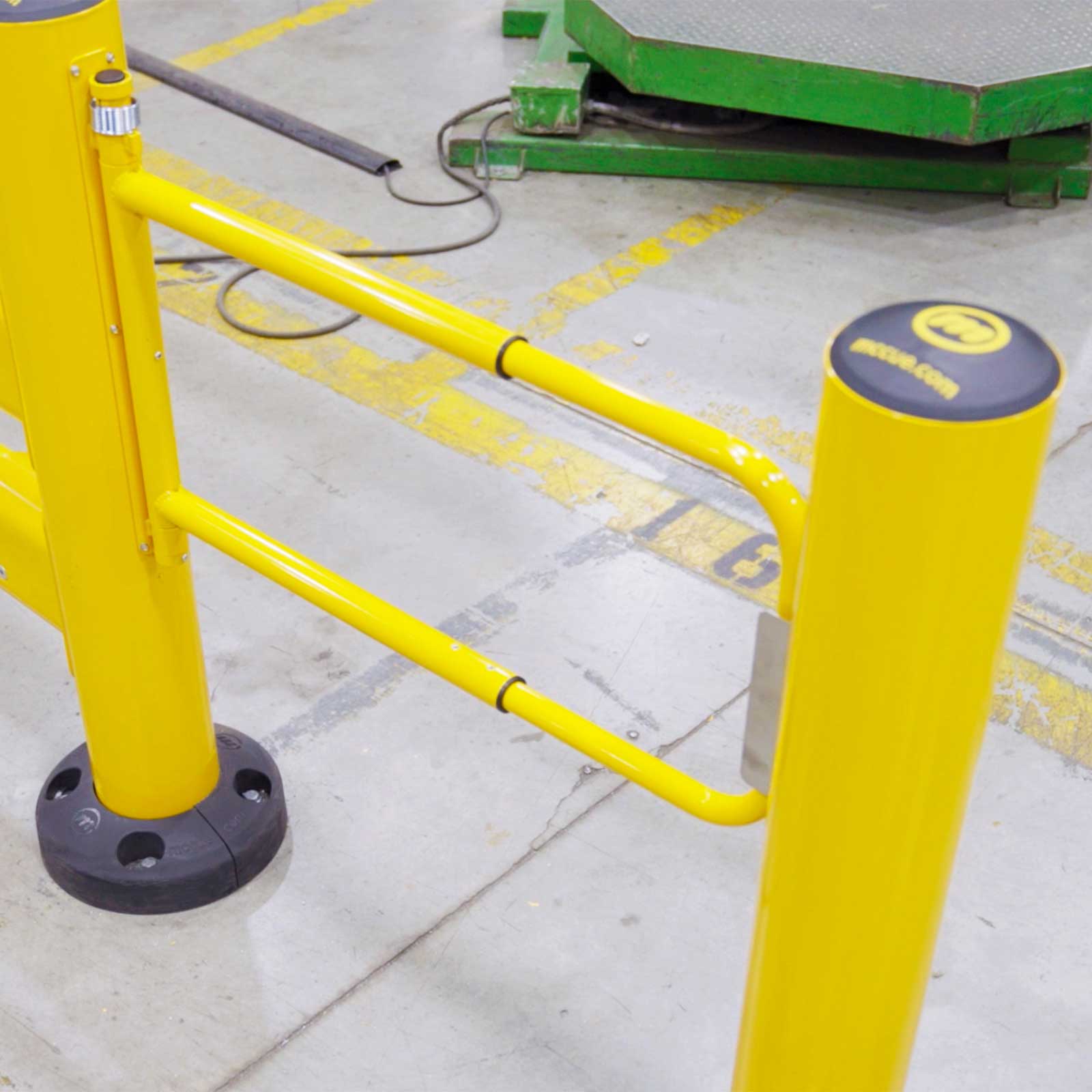 SafeStop Pedestrian Swing Gate add-on, a yellow swing gate mounted on a SafeStop GuardRail post.
