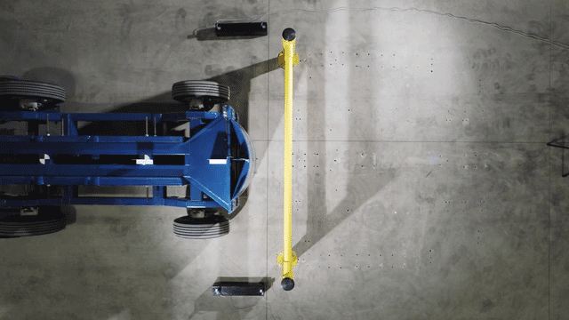 Overhead view of a SafeStop GuardRail impact test as a test rig strikes the rail and it flexes on impact.
