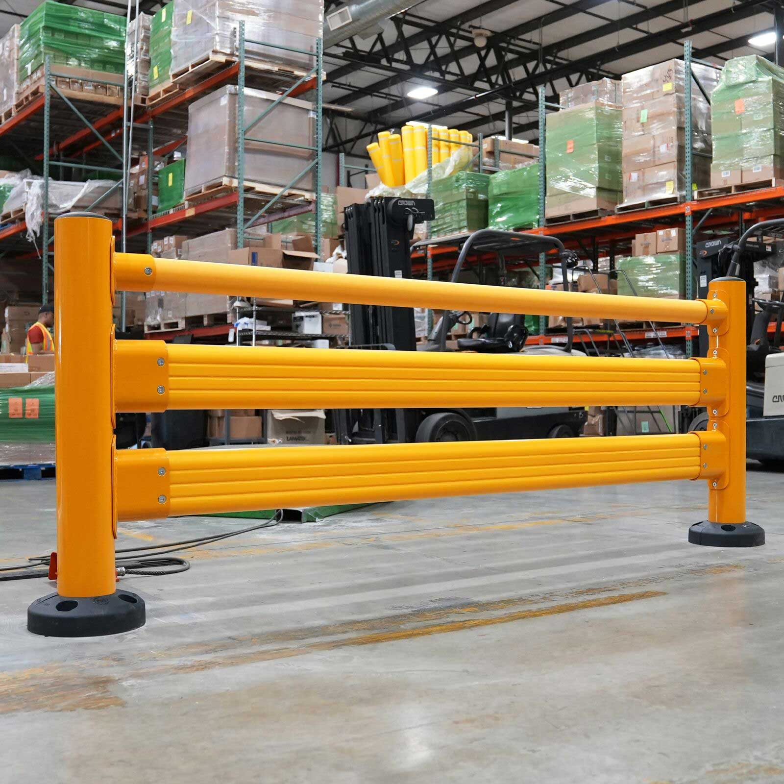 SafeStop Pedestrian GuardRail section with a top handrail in front of stocked pallet racking.