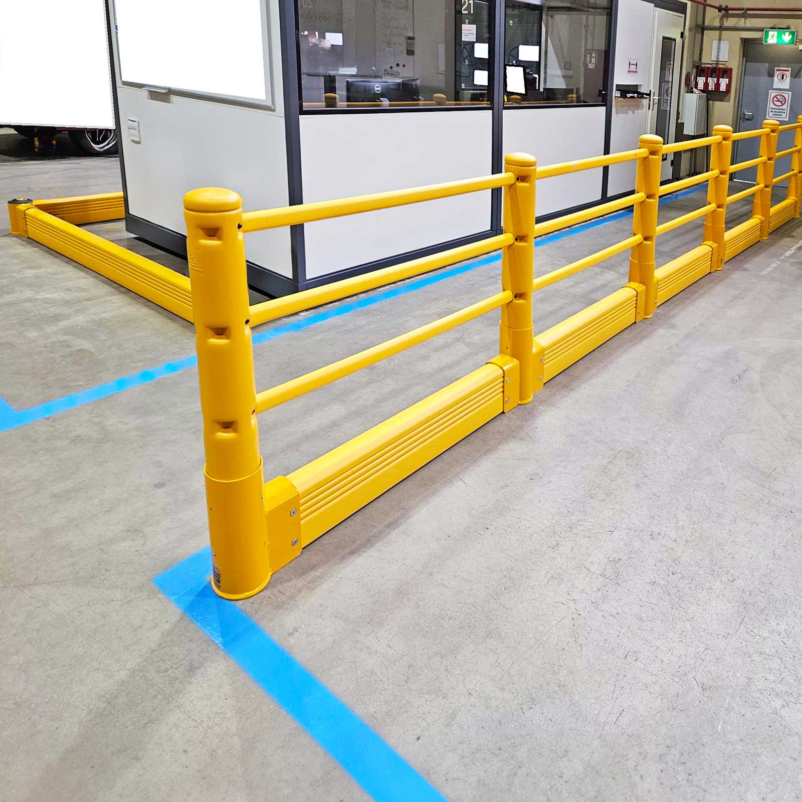 SafeStop Pedestrian with GroundBarrier run along the front of an in-plant office with blue floor marking.