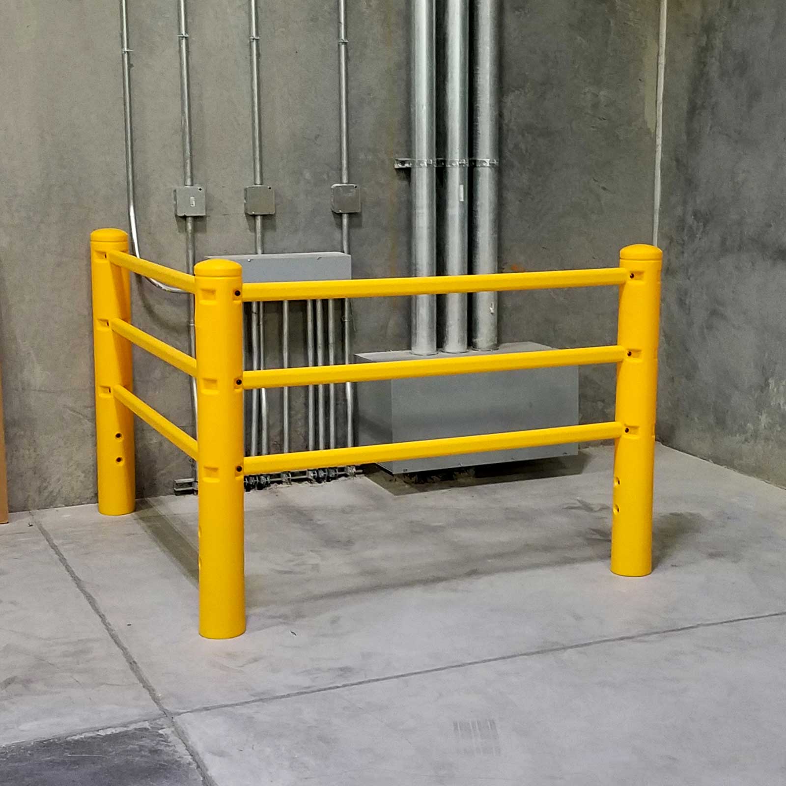 SafeStop PedestrianBarrier corner run around wall-mounted conduit and equipment in a facility corner.