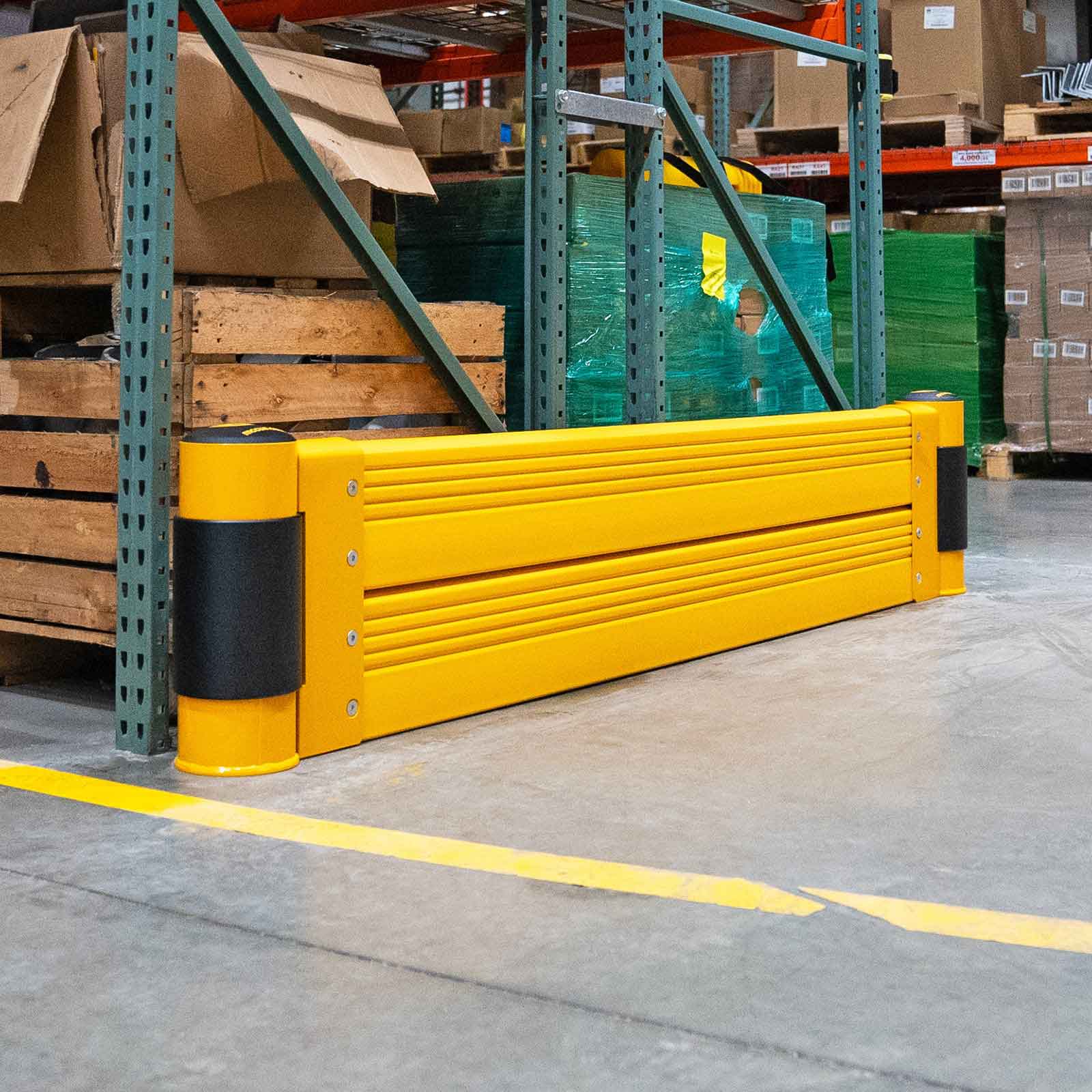 SafeStop RackEnd Protector Double pallet rack end protection at the end of a stocked pallet rack in a warehouse.