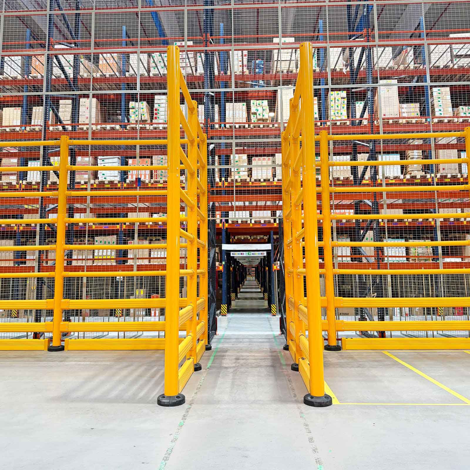 SafeStop ToppleBarrier 176 panels protecting loaded pallet racking on both sides of a forklift aisle.