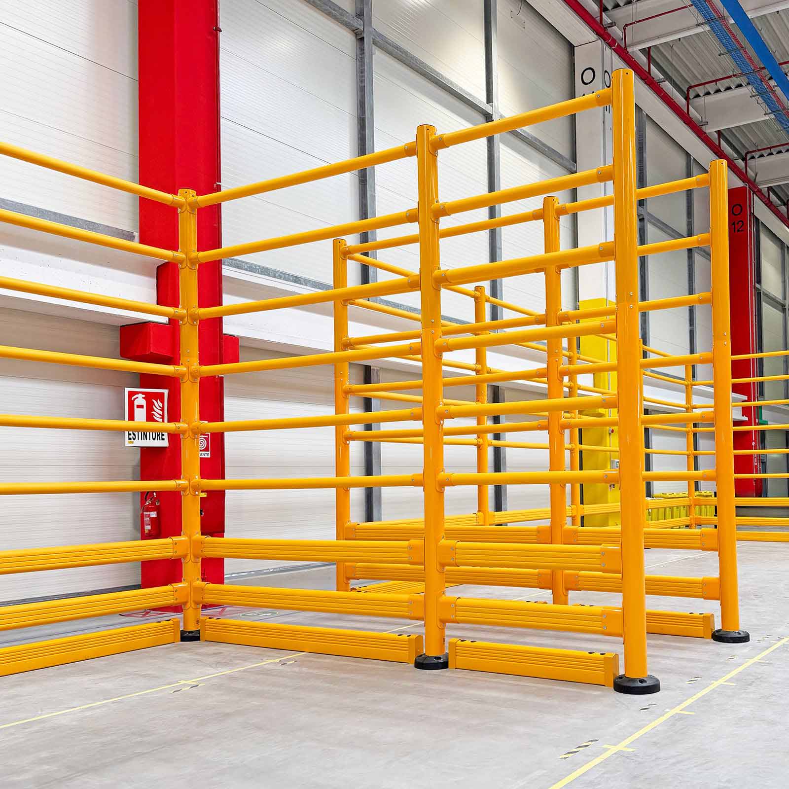 SafeStop ToppleBarrier 176 warehouse topple barriers guarding a wall and column corner beside a forklift aisle.