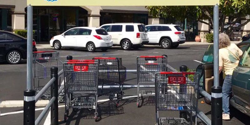 McCue Cart Corral with signage in Parking Lot