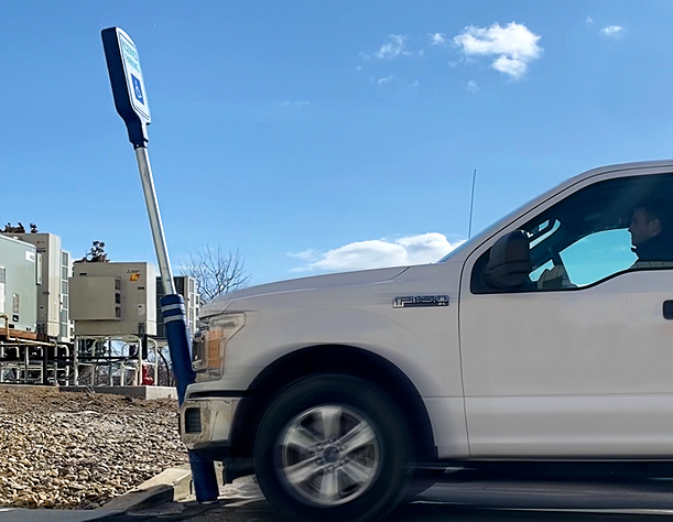 McCue BumperSign Flex protecting sign against car impacts and bumps in a parking area