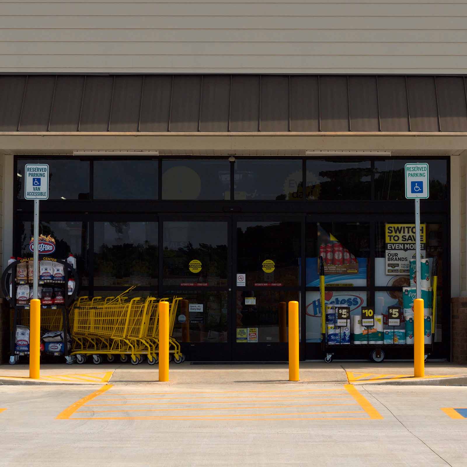 McCue Crash Tested ASTM F3016 CrashCore Bollard with Sign Post in parking lot