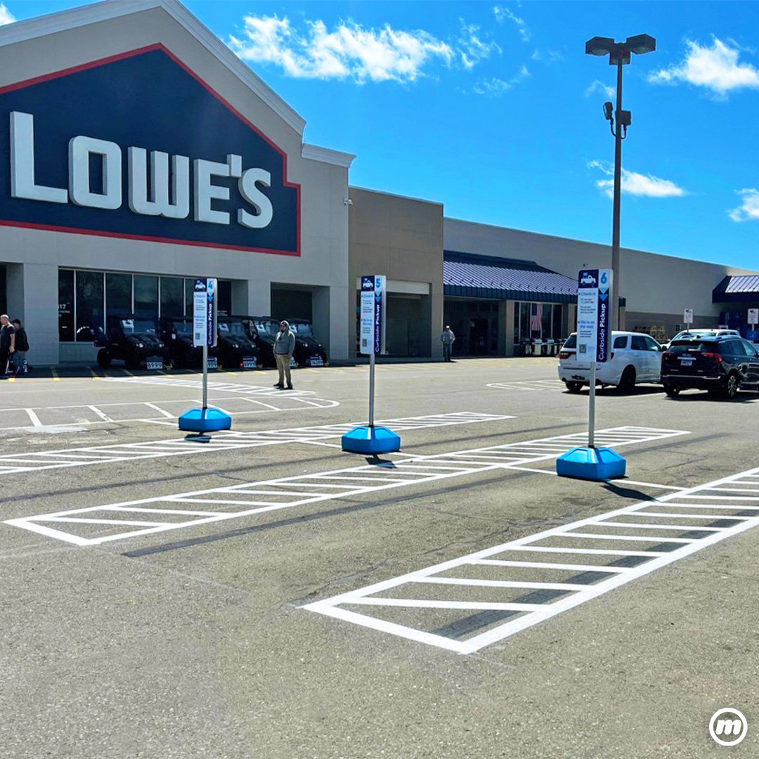 BumperSign Mobile with 12x18 Sign in a parking lot.